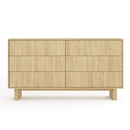 Wooden dresser with four drawers on a white background