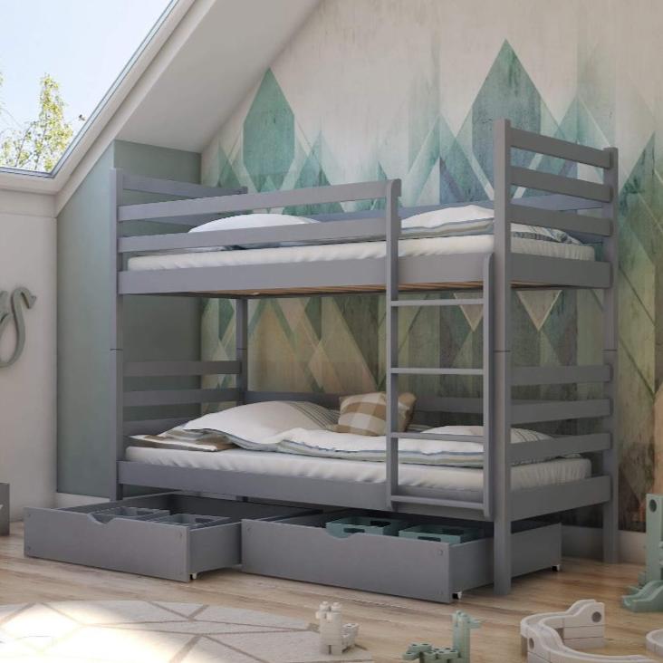 Gray bunk bed with storage drawers in a room with geometric wall design