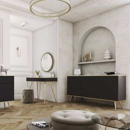 Modern interior design with black furniture, gold legs, and decorative elements.