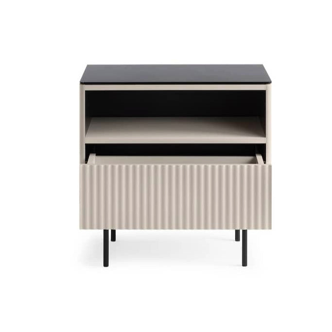 Modern side table with black top and ribbed white base on a white background