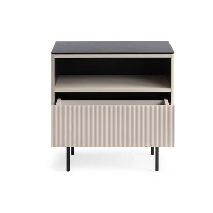 Modern side table with black top and ribbed white base on a white background