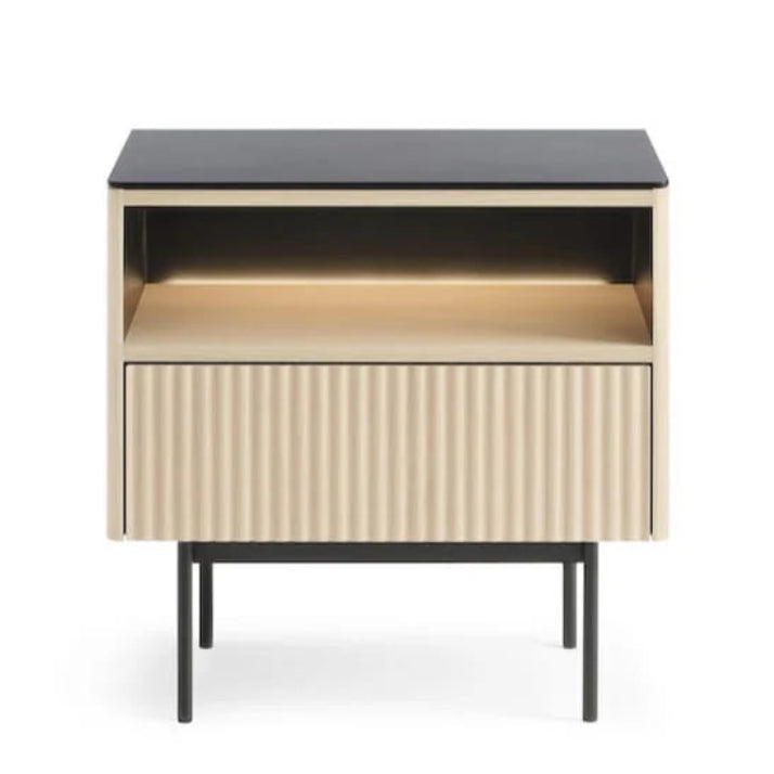 Modern side table with black top and beige cabinet on a white background