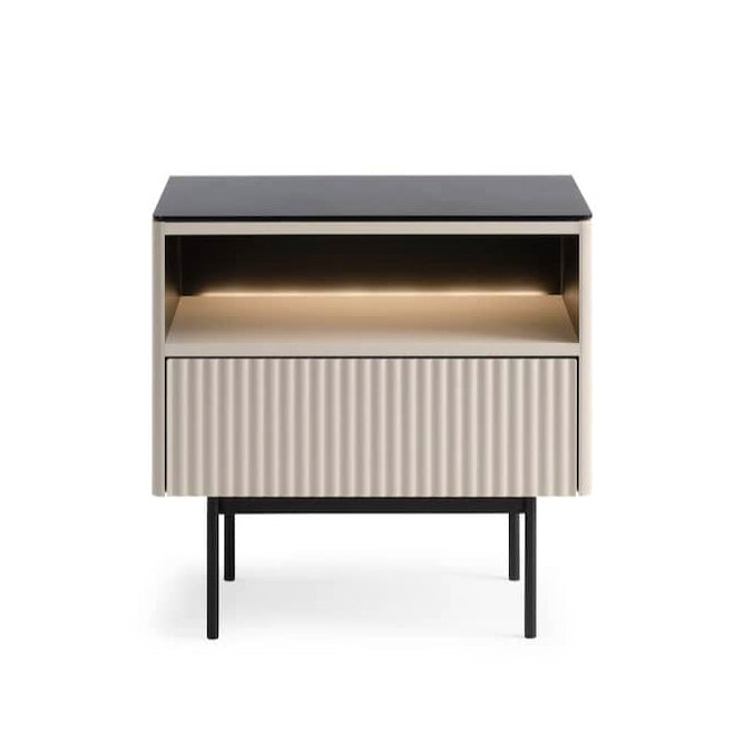 Modern side table with a black top and striped patterned base on a white background