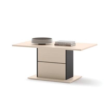 Small table with two drawers and two round objects on a white background