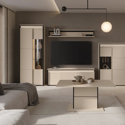 Modern living room with a television and decorative items.