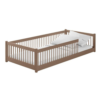 Wooden crib with white mattress on a white background