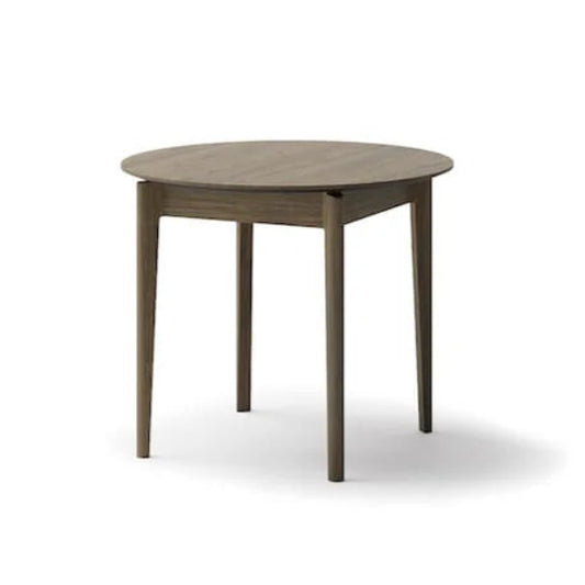 Round wooden table on a white background