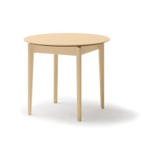 Round wooden table on a white background