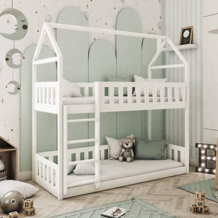 White children's bunk bed in a room with green walls and decorative elements.