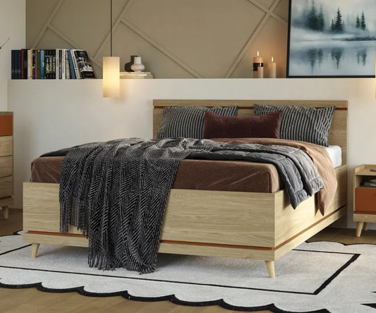 Wooden bed with bedding and pillows in a bedroom setting