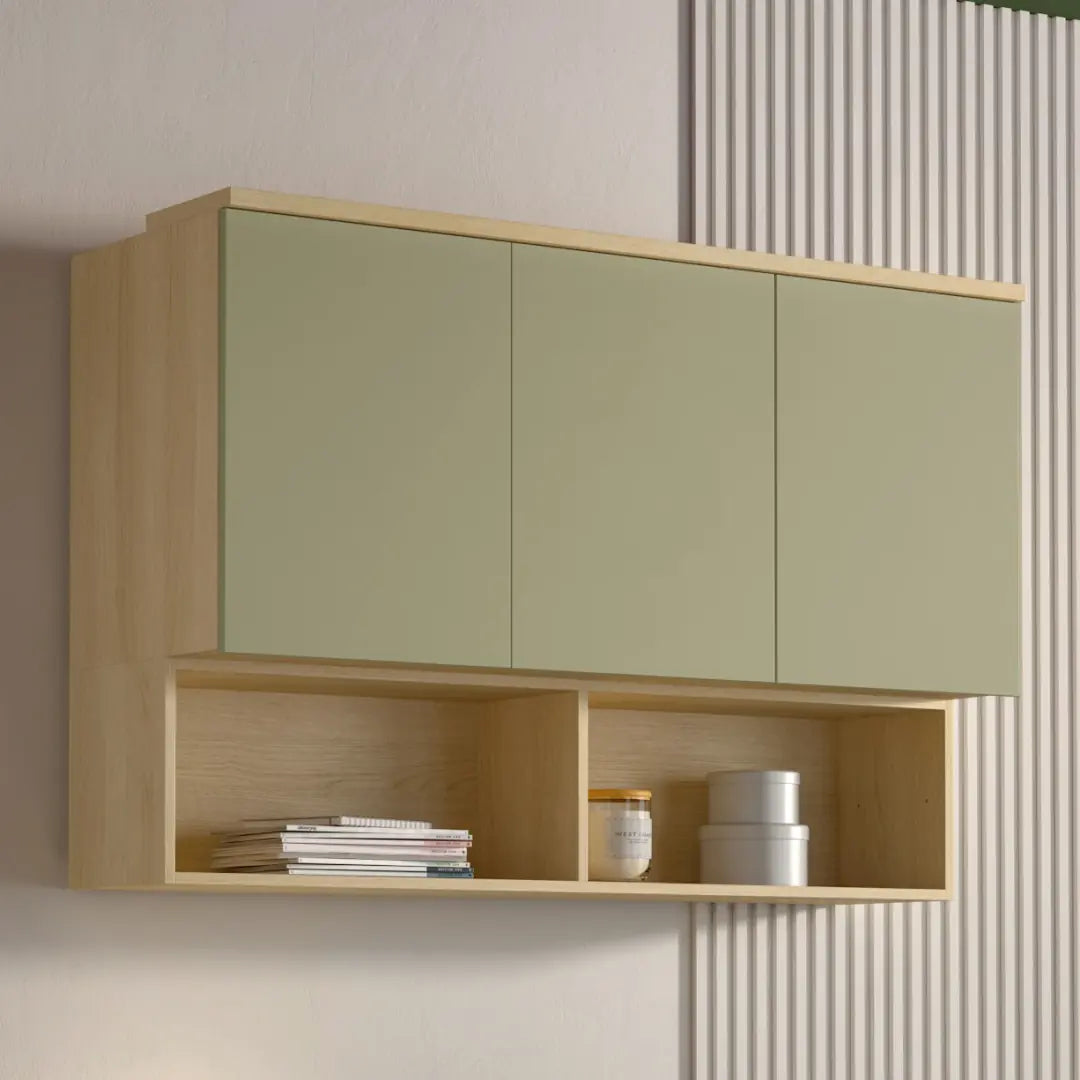Wall-mounted cabinet with green doors and wooden shelf against a neutral wall.
