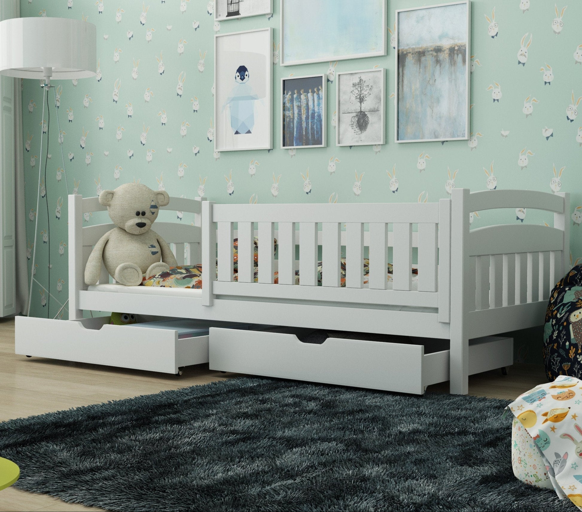 Children's room with a white crib, teddy bear, and decorative elements.
