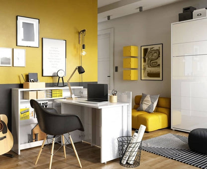 Modern home office with yellow walls, desk, chair, and decor.