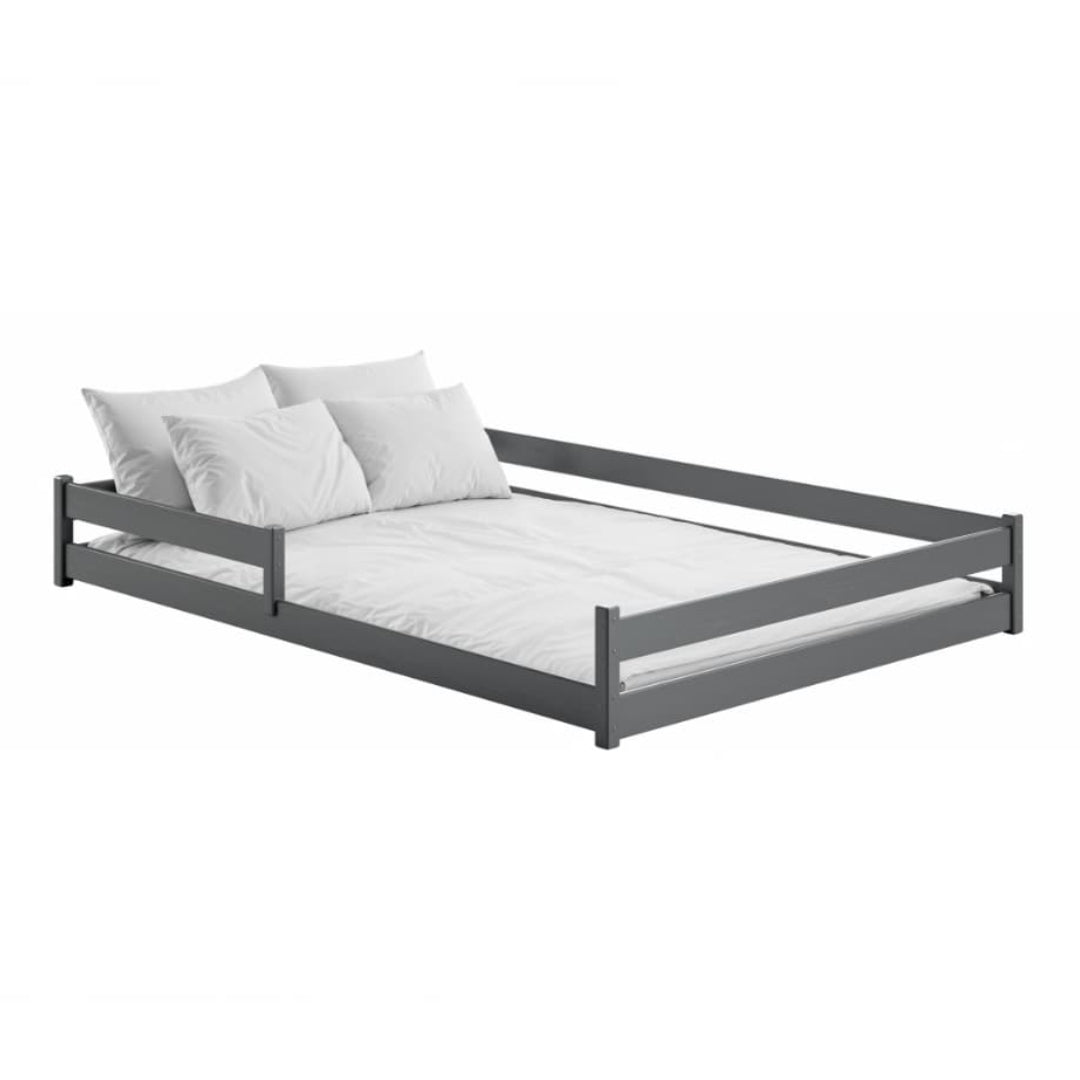 Gray bed frame with white mattress and pillows on a white background