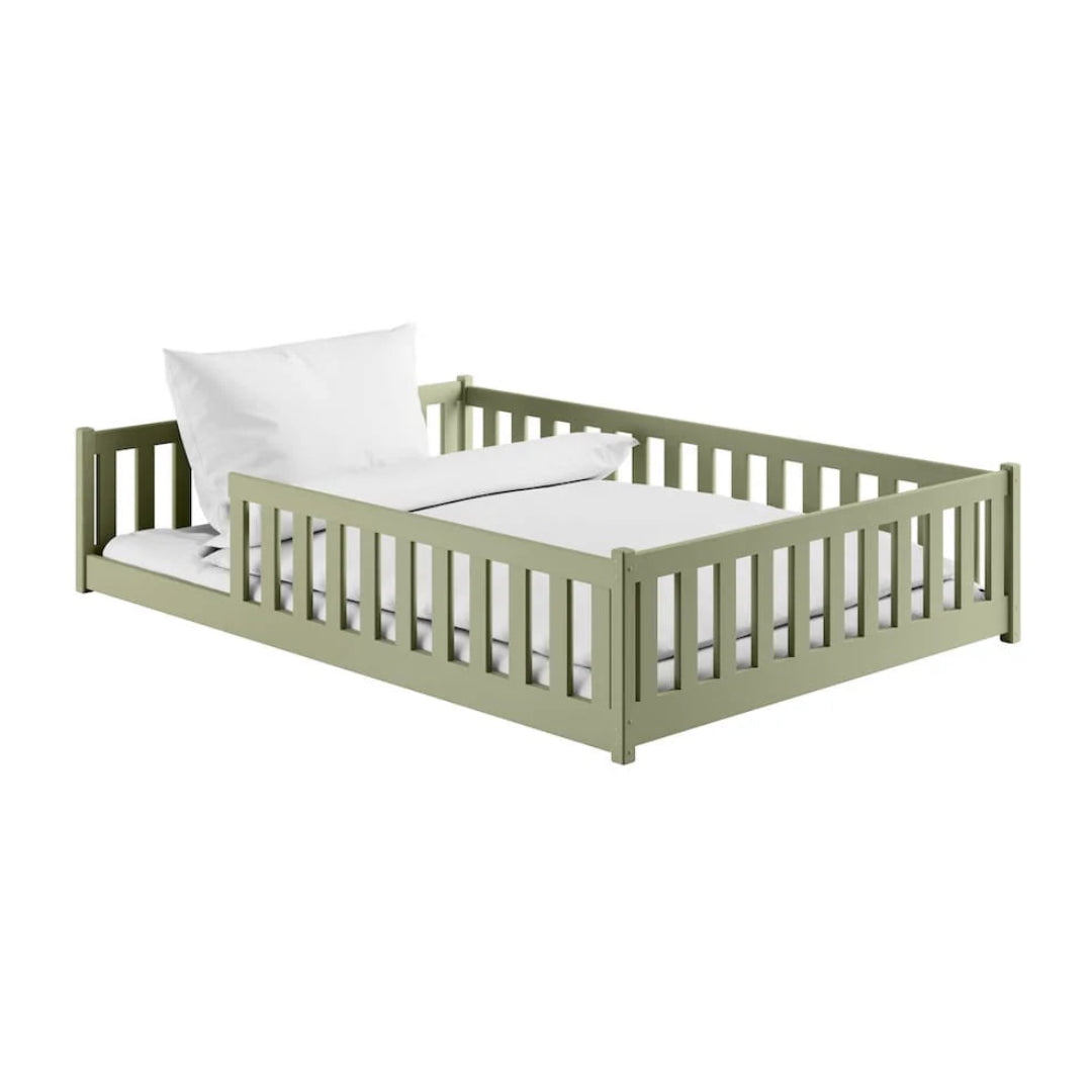 Green children's bed with white bedding on a white background
