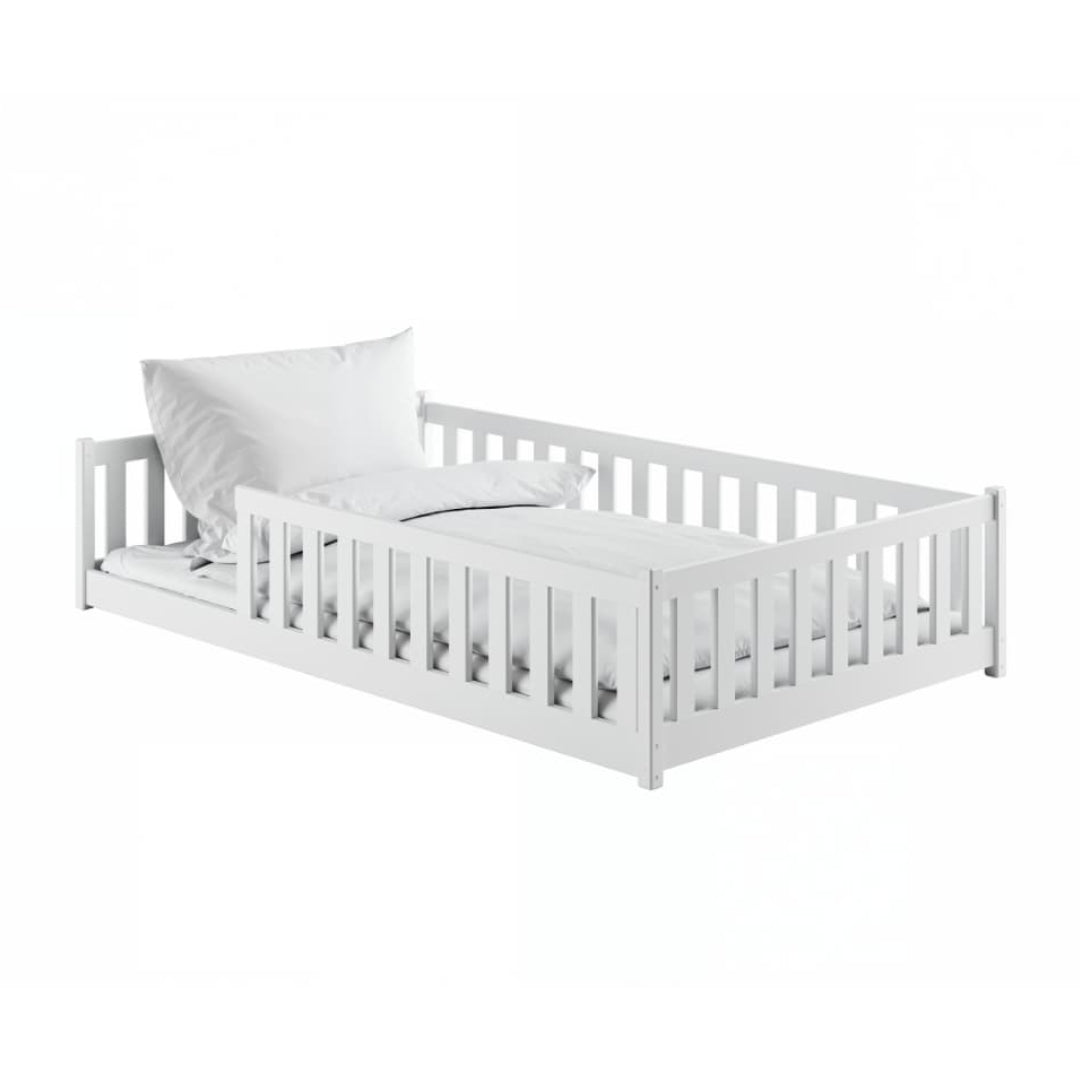 White wooden bed with a pillow on a white background