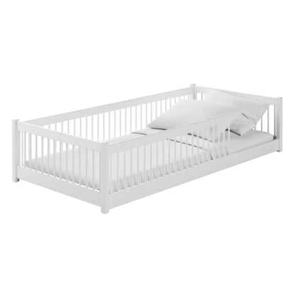 White crib with mattress on a white background