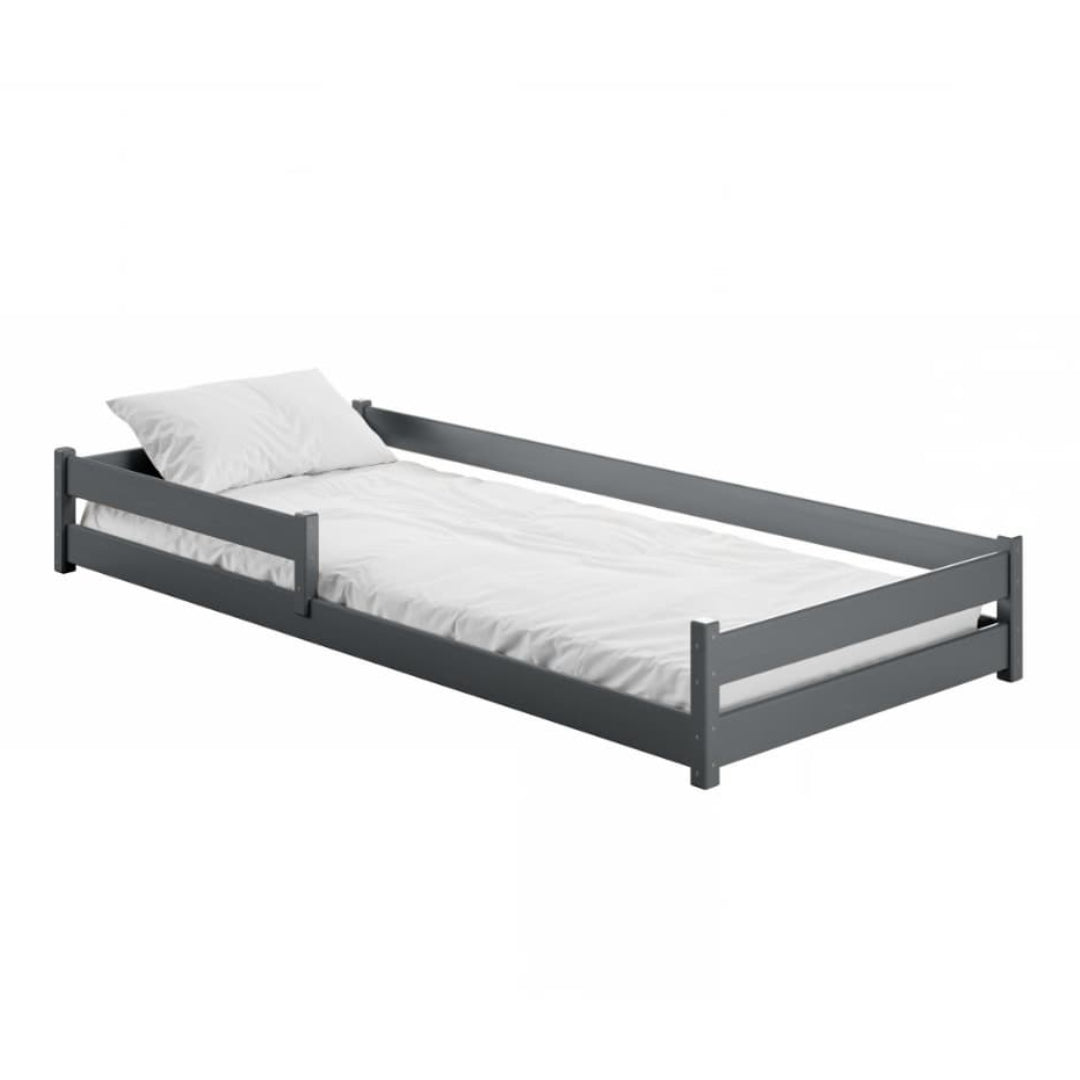 Gray single bed with white mattress and pillow on a white background