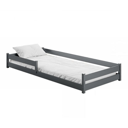 Gray single bed with white mattress and pillow on a white background