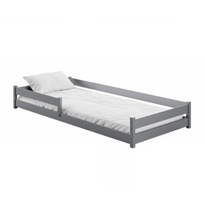 Gray bed frame with white mattress and pillow on a white background