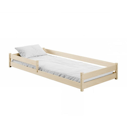 Wooden bed with white mattress and pillow on a white background