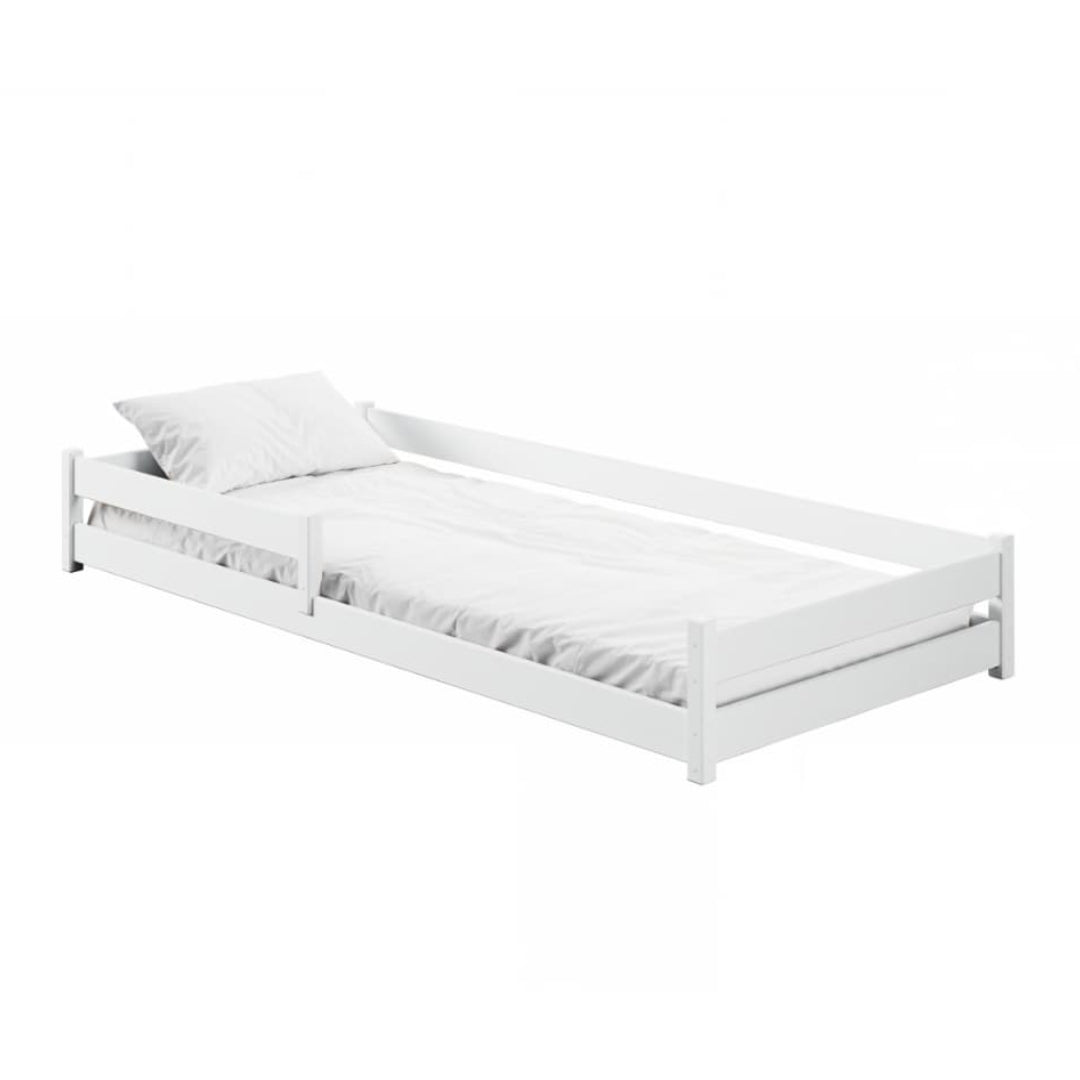 White bed frame with a pillow on a white background
