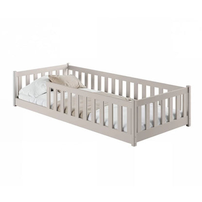 Children's bed with white bedding and pillows on a white background