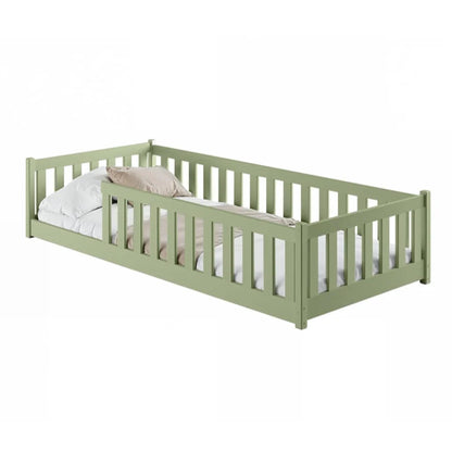 Green children's bed with white bedding on a white background