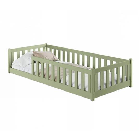 Green children's bed with white bedding on a white background