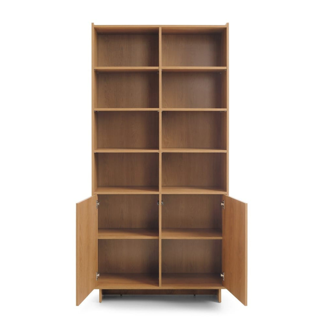 Wooden bookshelf with open doors on a white background