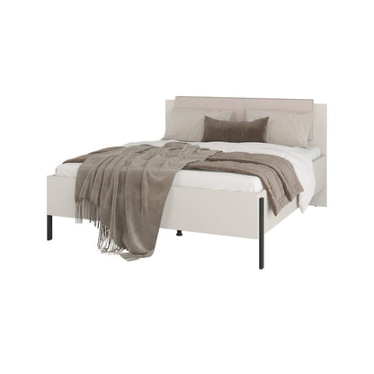 White bed with gray bedding on a white background