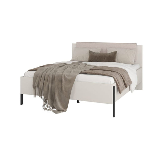 White bed with gray bedding on a white background