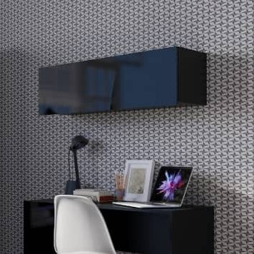 Modern office setup with a desk, chair, and wall-mounted shelves against a patterned wallpaper.