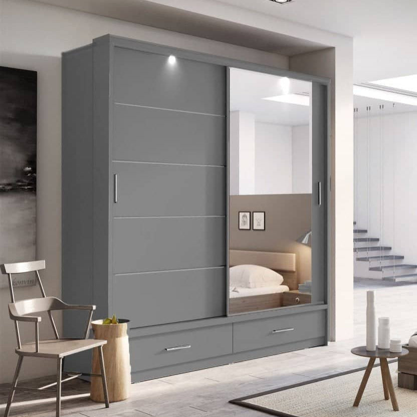 Modern bedroom with gray wardrobe and wooden bed