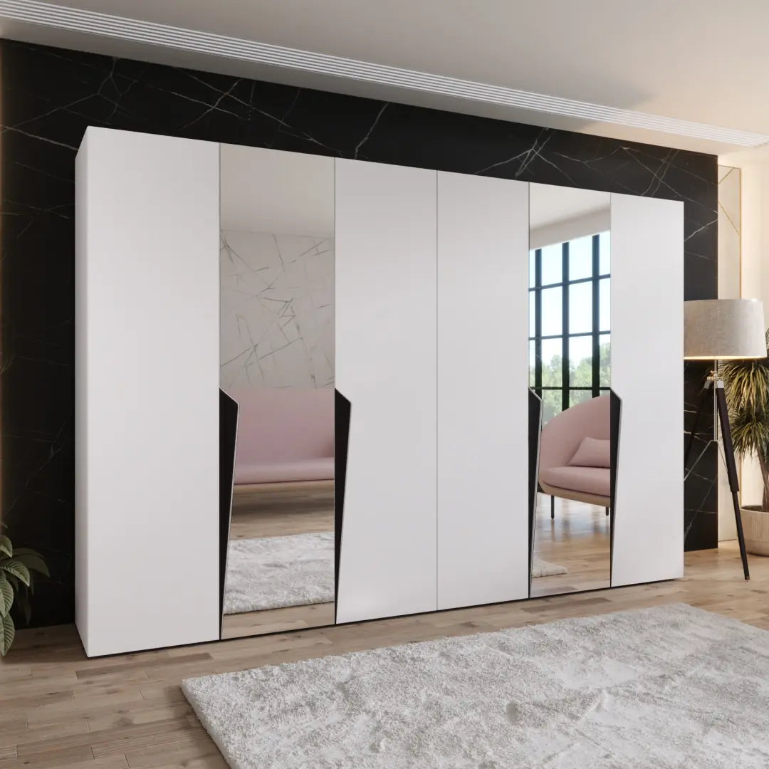 Modern white wardrobe with mirror doors in a stylish room.