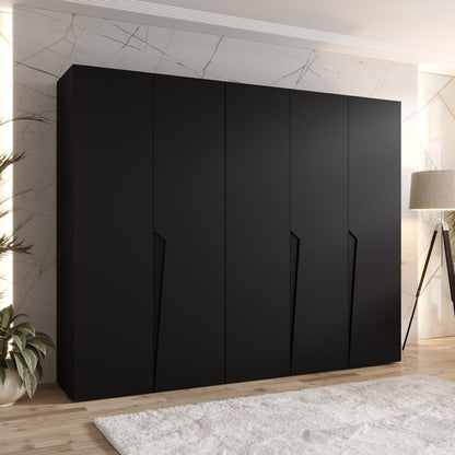 Black wardrobe in a room with a lamp and plant