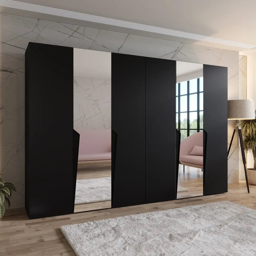 Modern interior with black wall-mounted cabinets and a pink sofa.