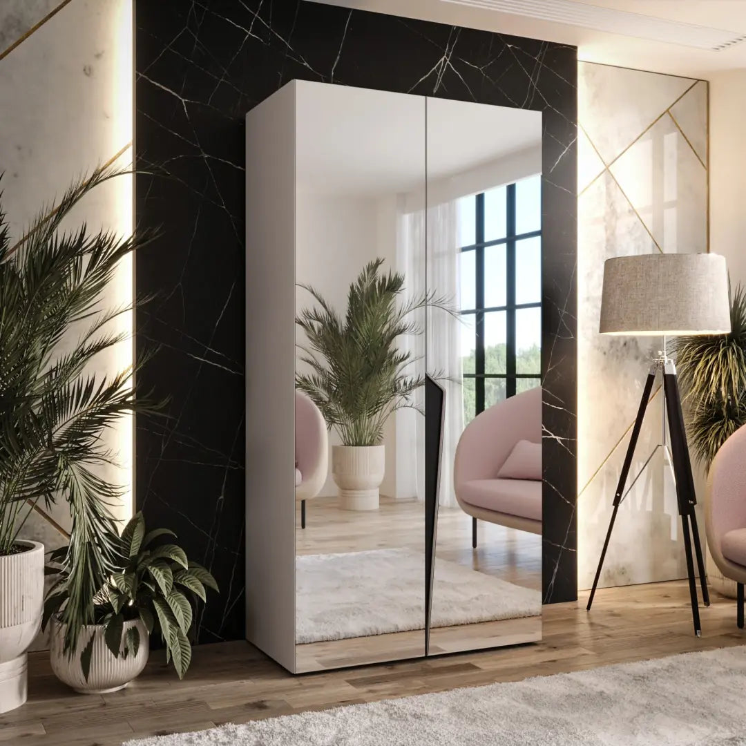 Modern wardrobe with mirror in a stylish room with plants and decor.
