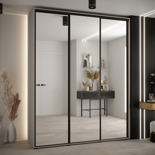 Modern sliding wardrobe with glass doors in a stylish room.