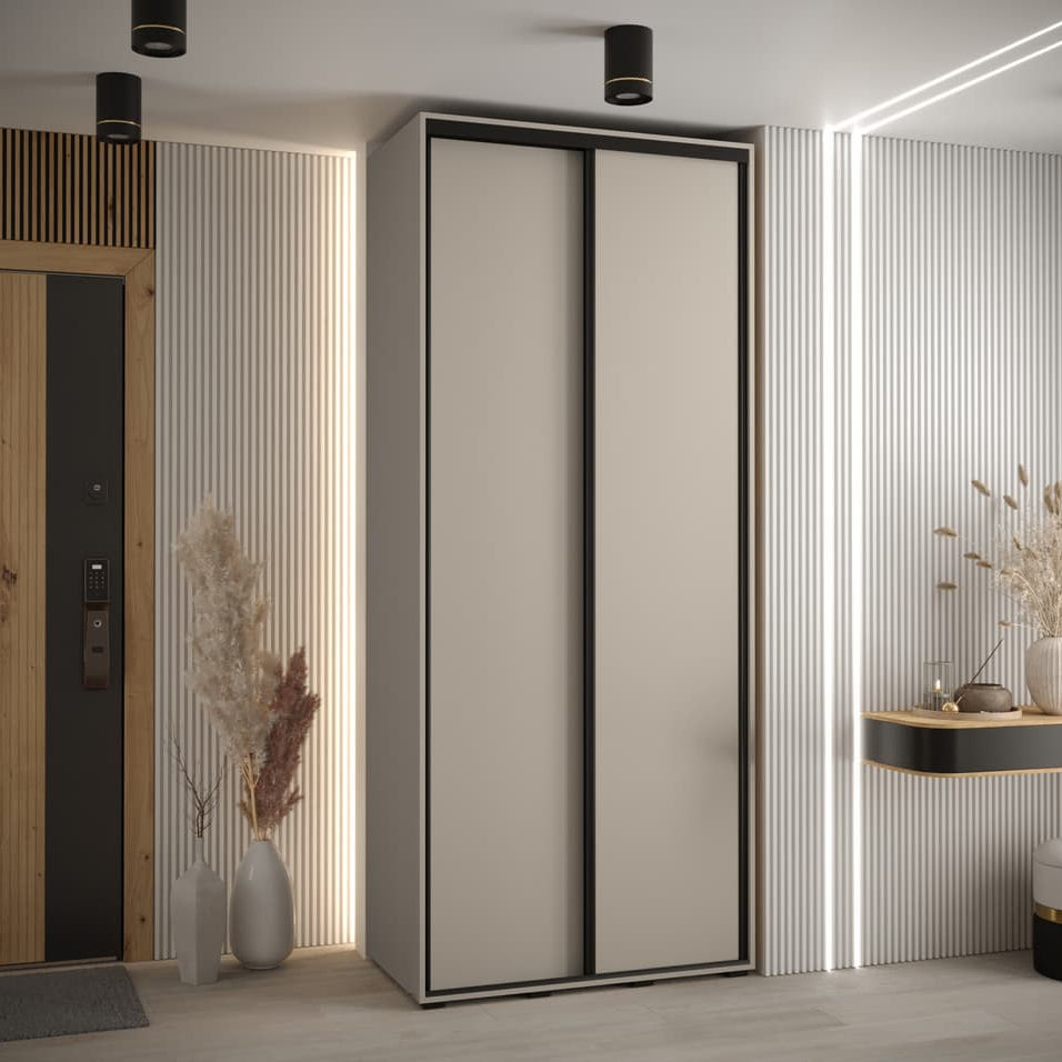 Modern wardrobe with sliding doors in a room with decorative elements.