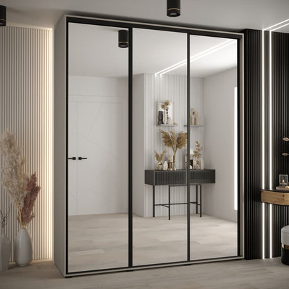 Modern sliding wardrobe with glass doors in a stylish room.