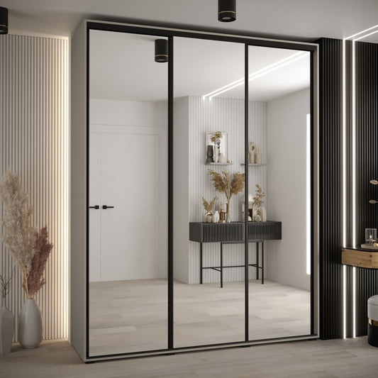 Modern sliding wardrobe with glass doors in a stylish room.