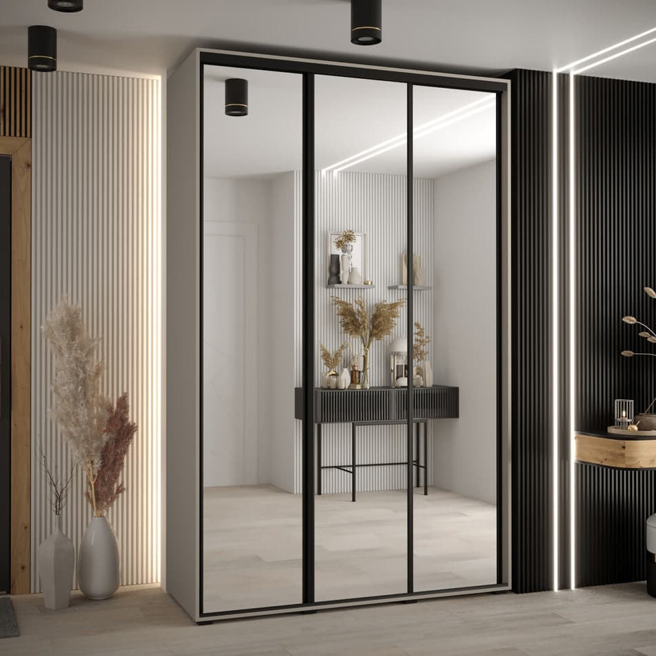 Modern interior design with a wardrobe featuring sliding glass doors.
