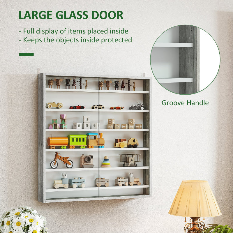 Wall-mounted storage cabinet with large glass door displaying various toys and items.