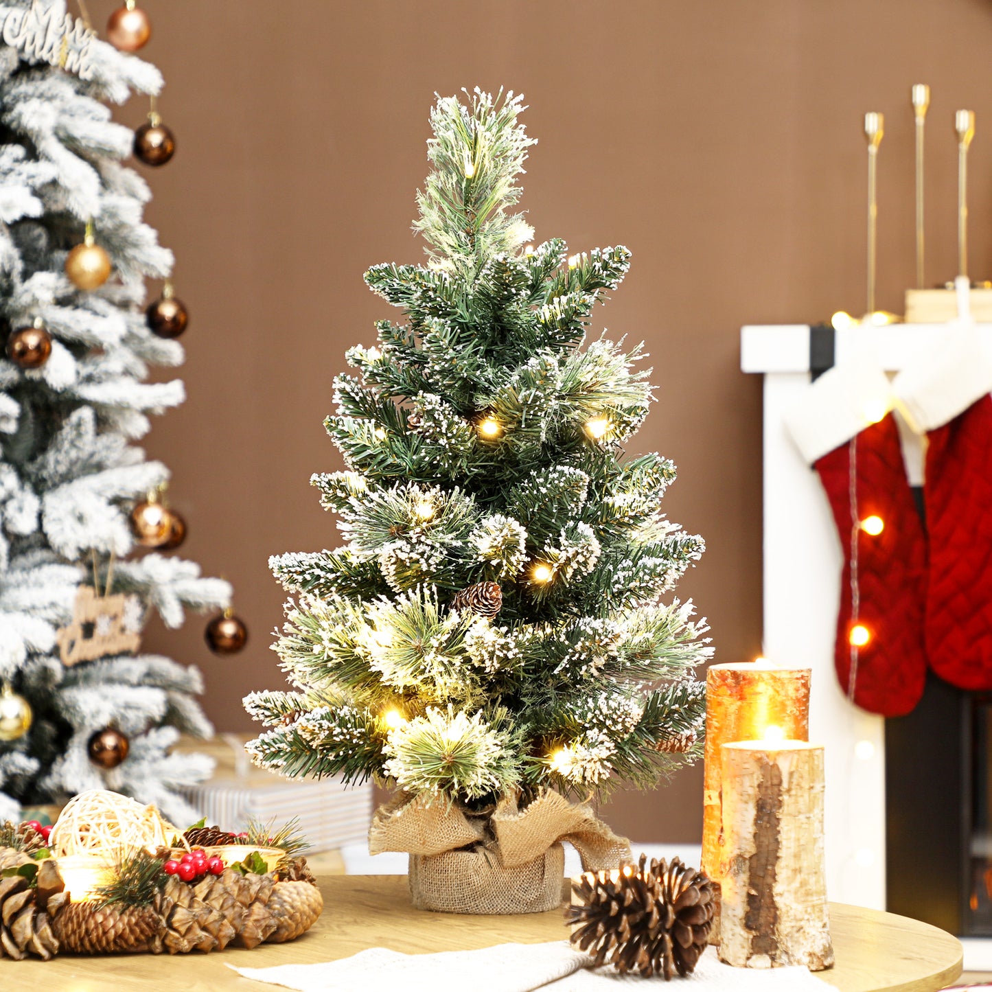 HOMCOM 60 cm Prelit Small Christmas Tree, Snow Flocked Tabletop Mini Xmas Tree with 35 LED Lights, Pine Cones and Linen Cover Base, Battery Operated, Green