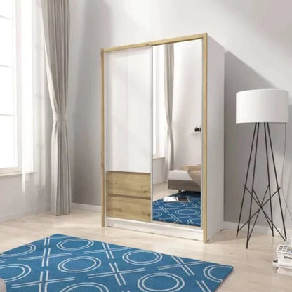 A white matt sliding door wardrobe with a mirrored door on the left and a hinged door on the right, set in a room with a blue patterned rug, a white floor lamp, and curtains in the background.