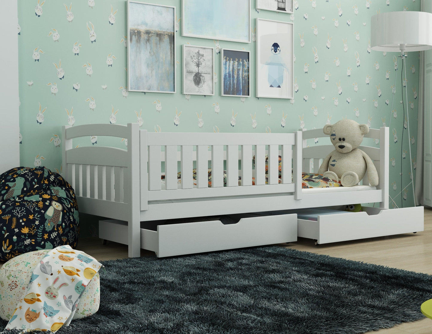 Children's room with a white crib, teddy bear, and decorative elements.