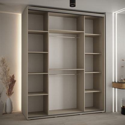 Beige wardrobe with sliding door in a room with striped walls and decorative elements.