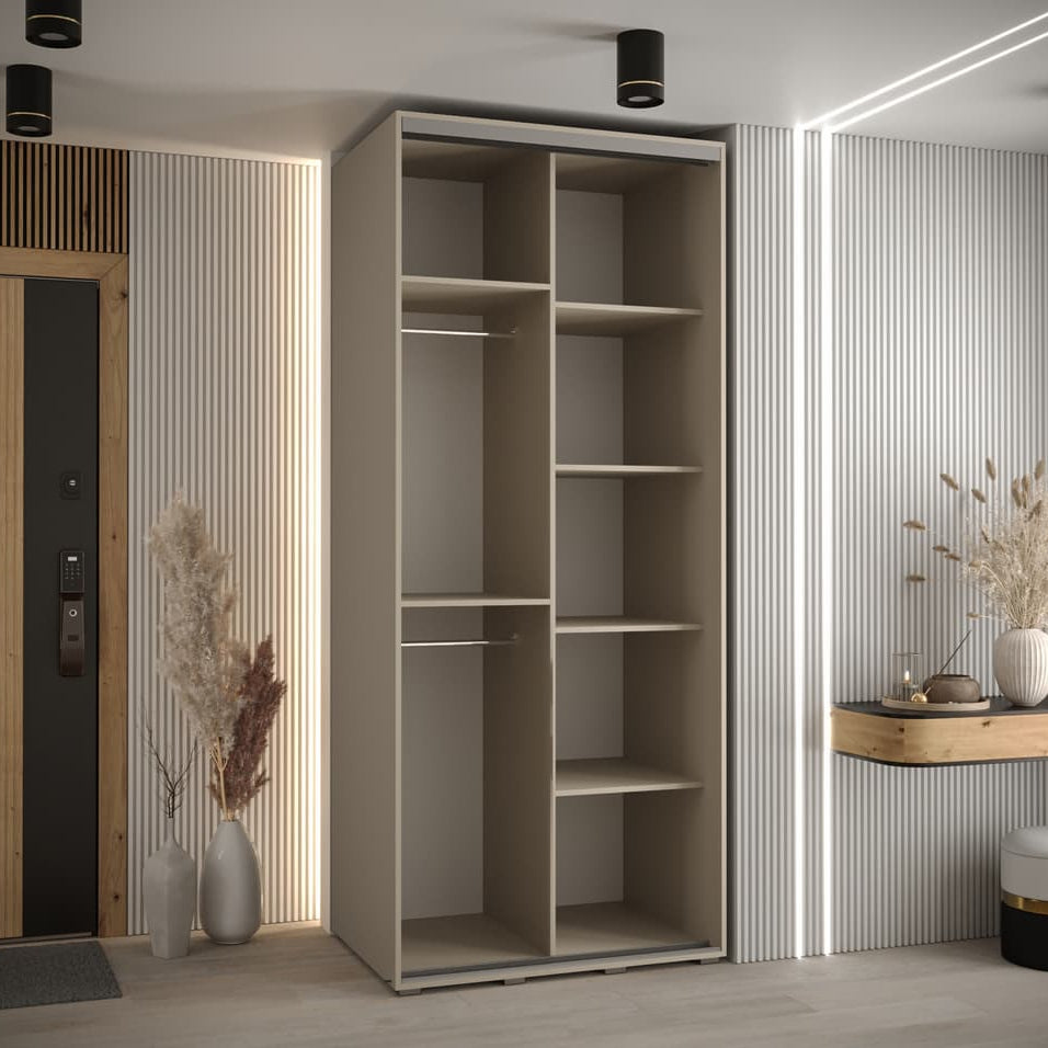 Modern interior with a tall beige wardrobe and decorative elements.