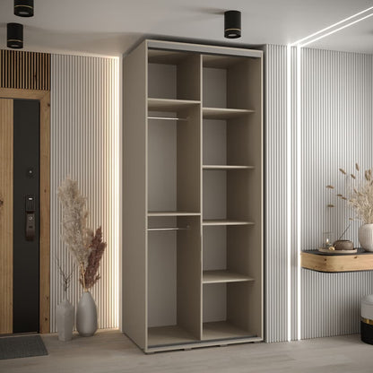 Modern interior with a tall beige wardrobe and decorative elements.